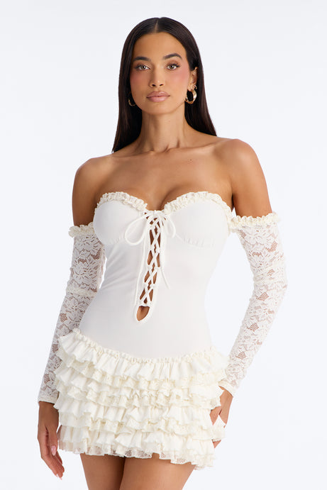 سيتروس mini dress مضلع بتفاصيل دانتيل وكشكش